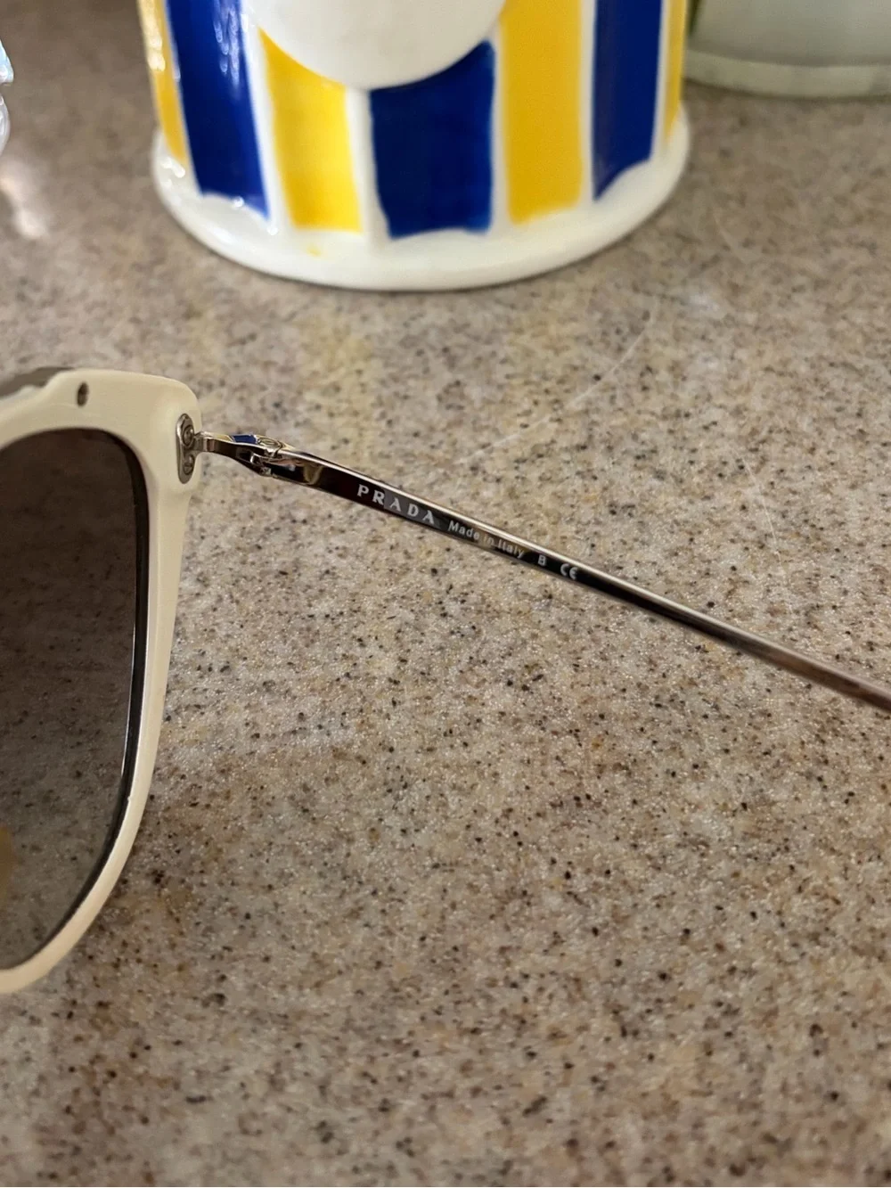 Prada Black and Gold Cat-Eye Sunglasses with Gradient Lenses